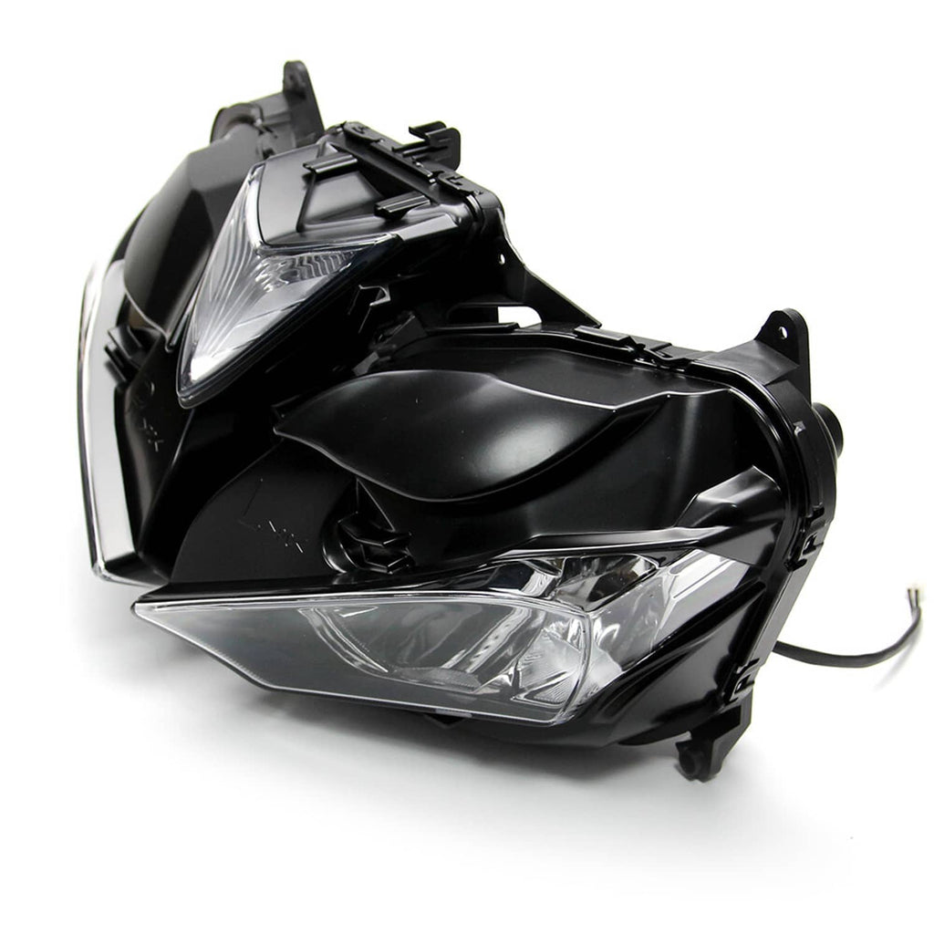 Clear-lens motorcycle headlight assembly with black housing, side-front angled view