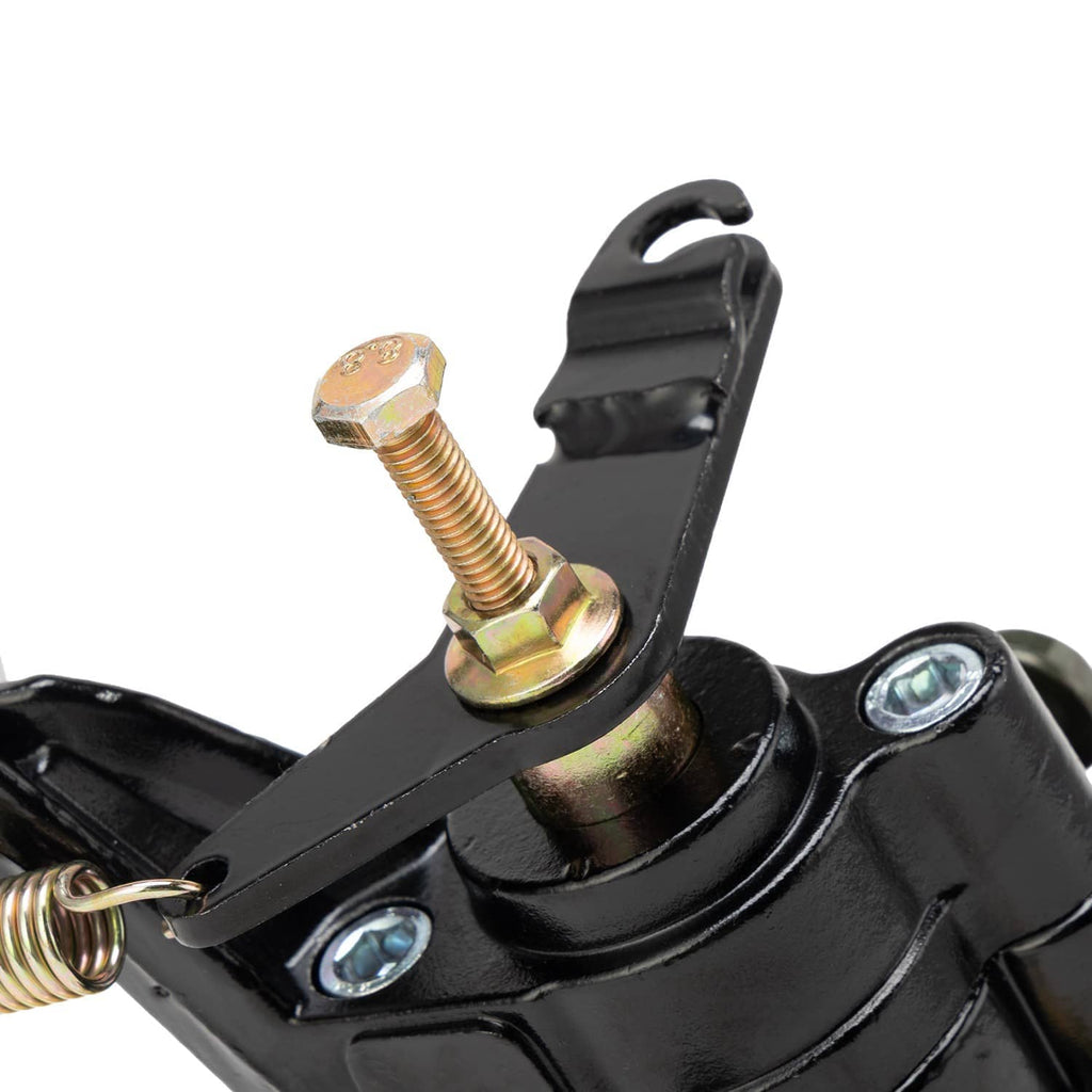 Rear brake caliper close-up showing black lever, coil spring, and hex bolts