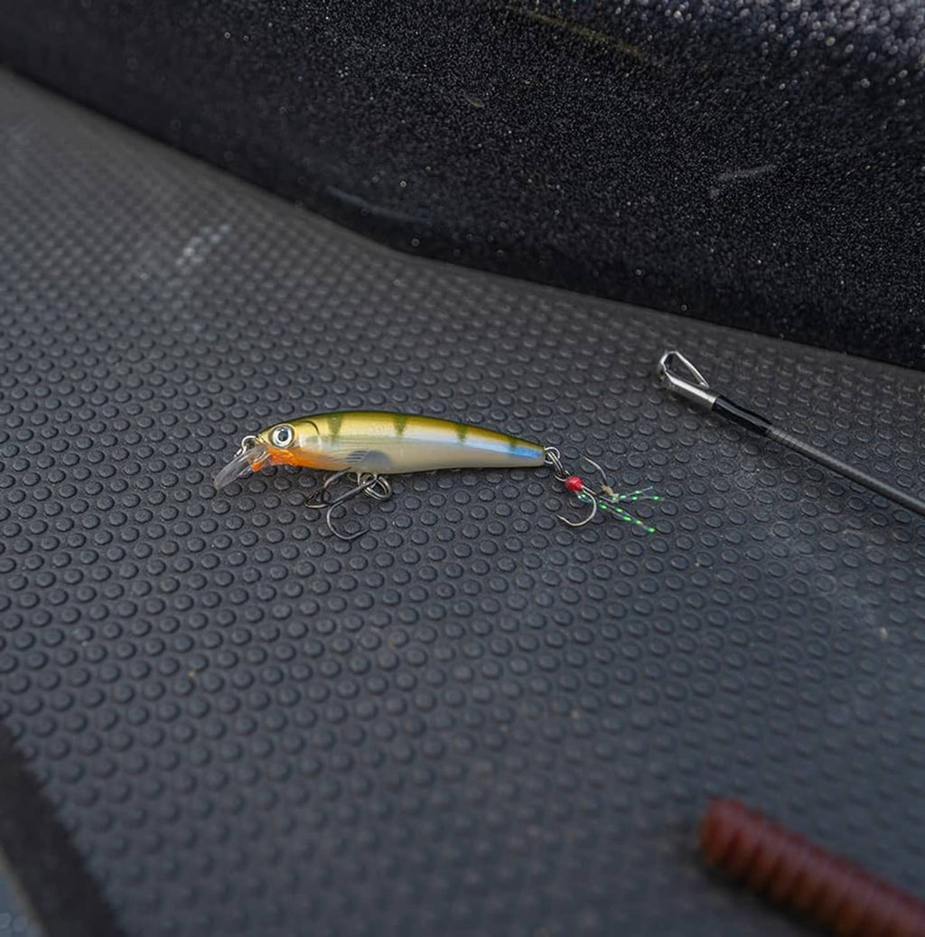 Yellow-green jerkbait with glossy belly, small treble hook