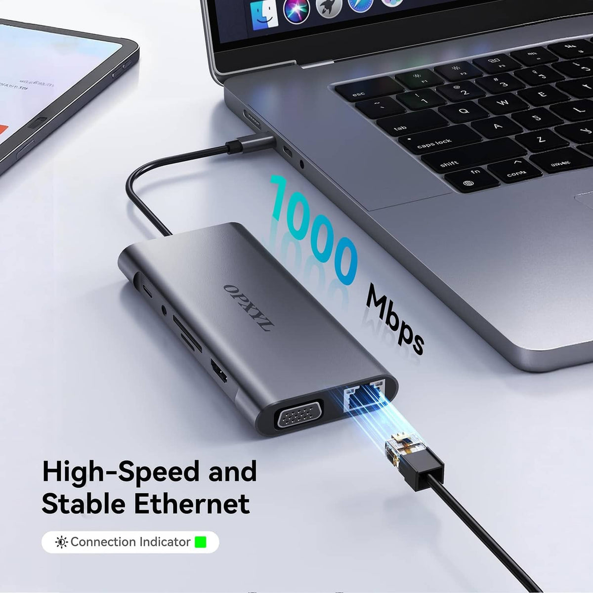 Grey USB-C hub with Ethernet port and connection indicator, plugged into a laptop
