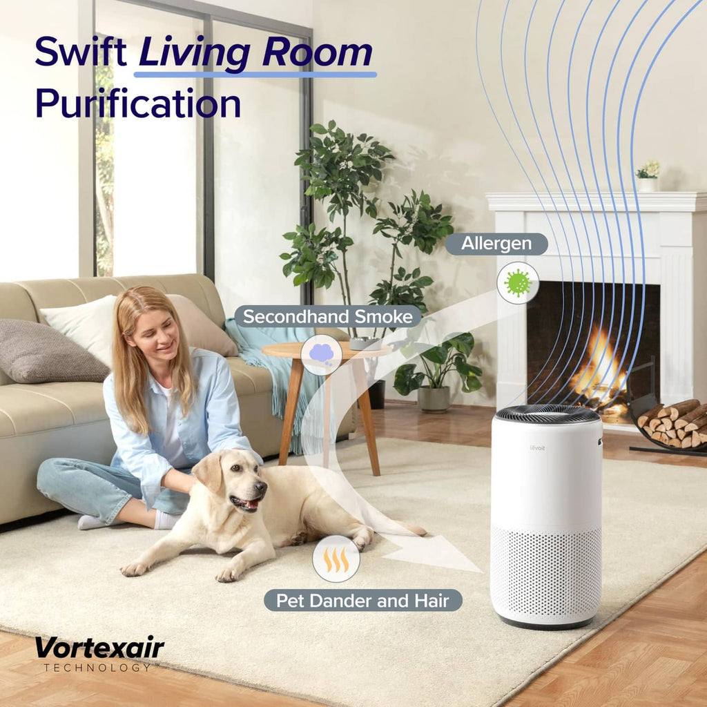 Cream white air purifier on the floor with a perforated front intake
