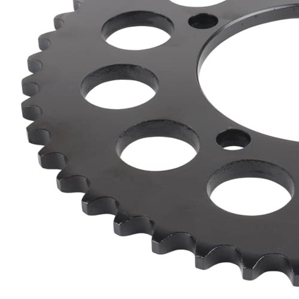 Close-up of black steel sprocket teeth and circular bolt-hole pattern