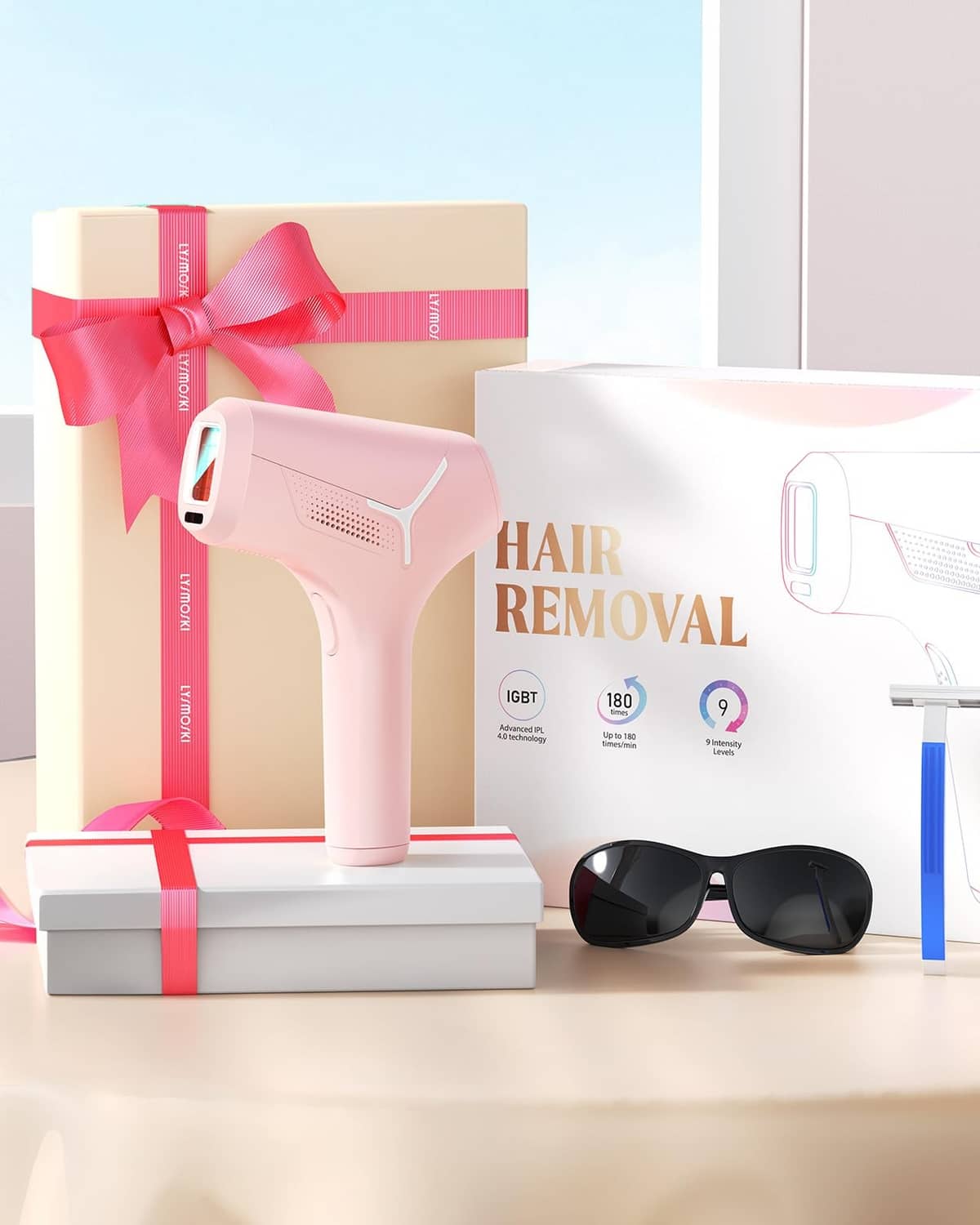 Pink at-home IPL hair removal device with boxed gift and black safety glasses