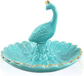 Turquoise ceramic peacock jewelry tray with gold trim and textured leaf base