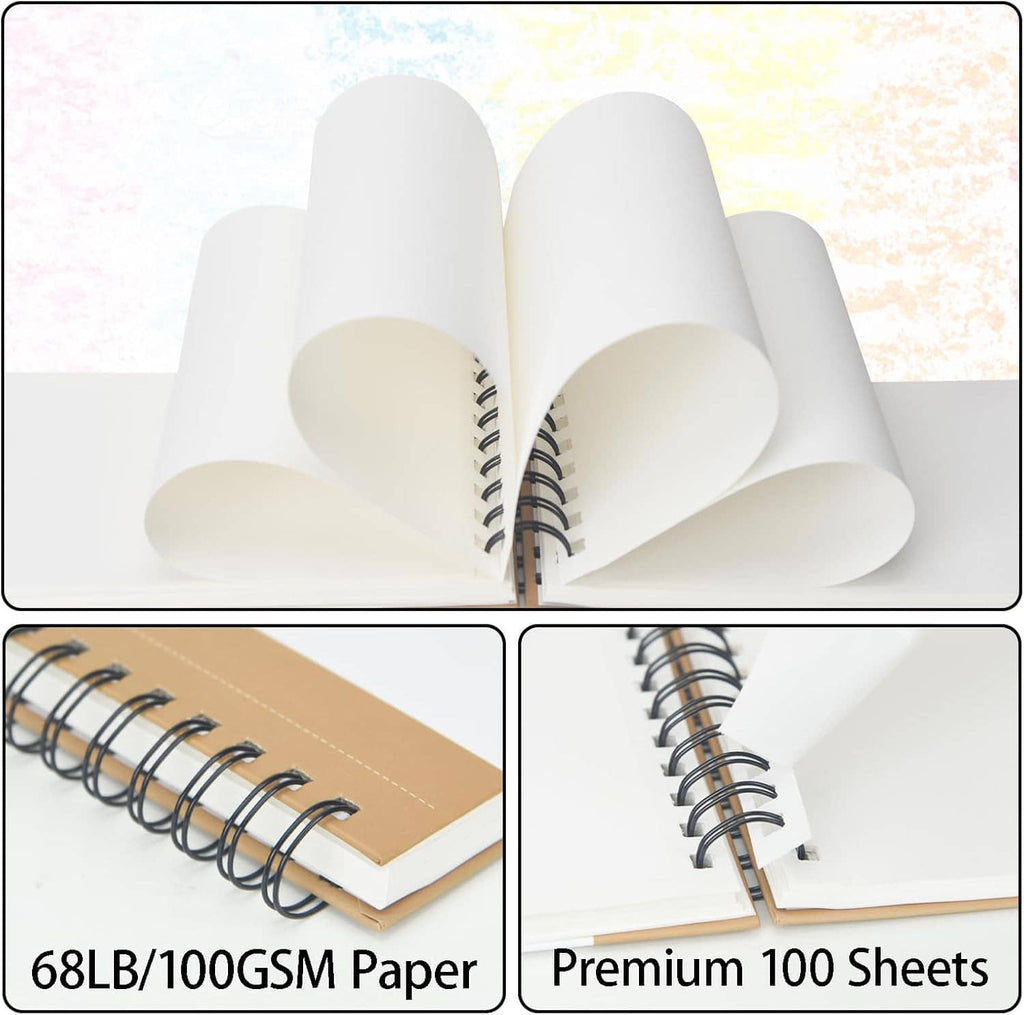 Open spiral sketch book showing thick white pages and black coil binding on kraft covers.