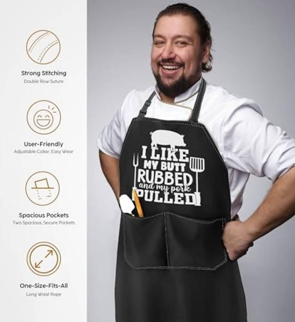 Black apron with large front pocket, novelty white print, worn over chef attire