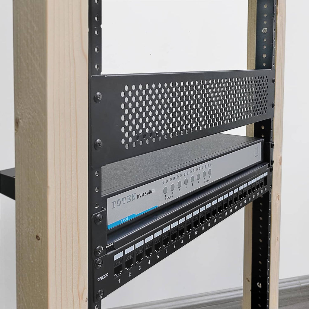Black rack rails with mounting holes installed inside an equipment rack frame