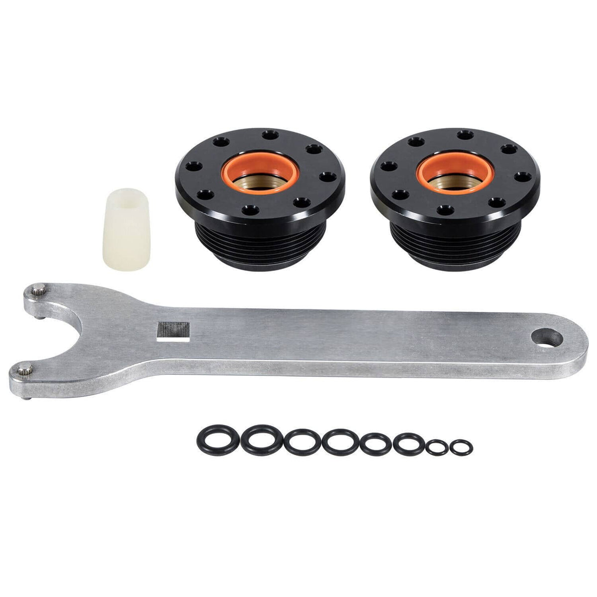Hydraulic seal kit parts: two black flanges with orange seals, metal tool, O-rings