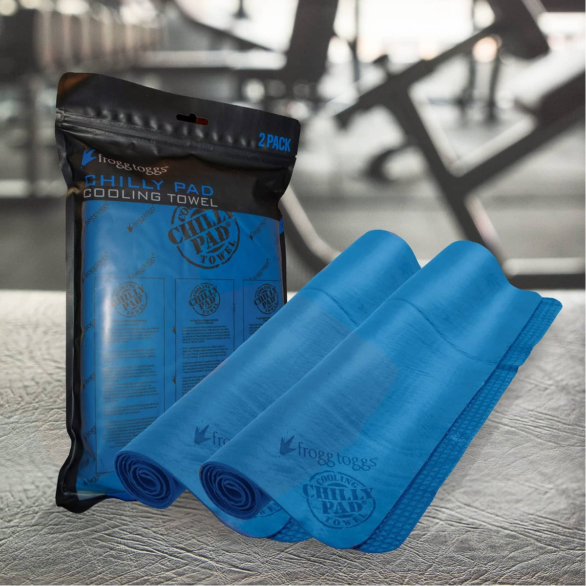 Blue cooling towels, rolled pair, with carry pouch behind