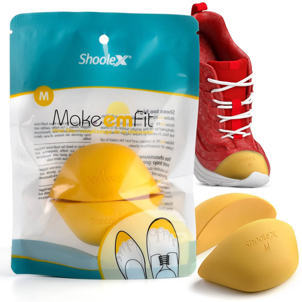 Shoe filler inserts with yellow M pads, shown with red-and-white boots