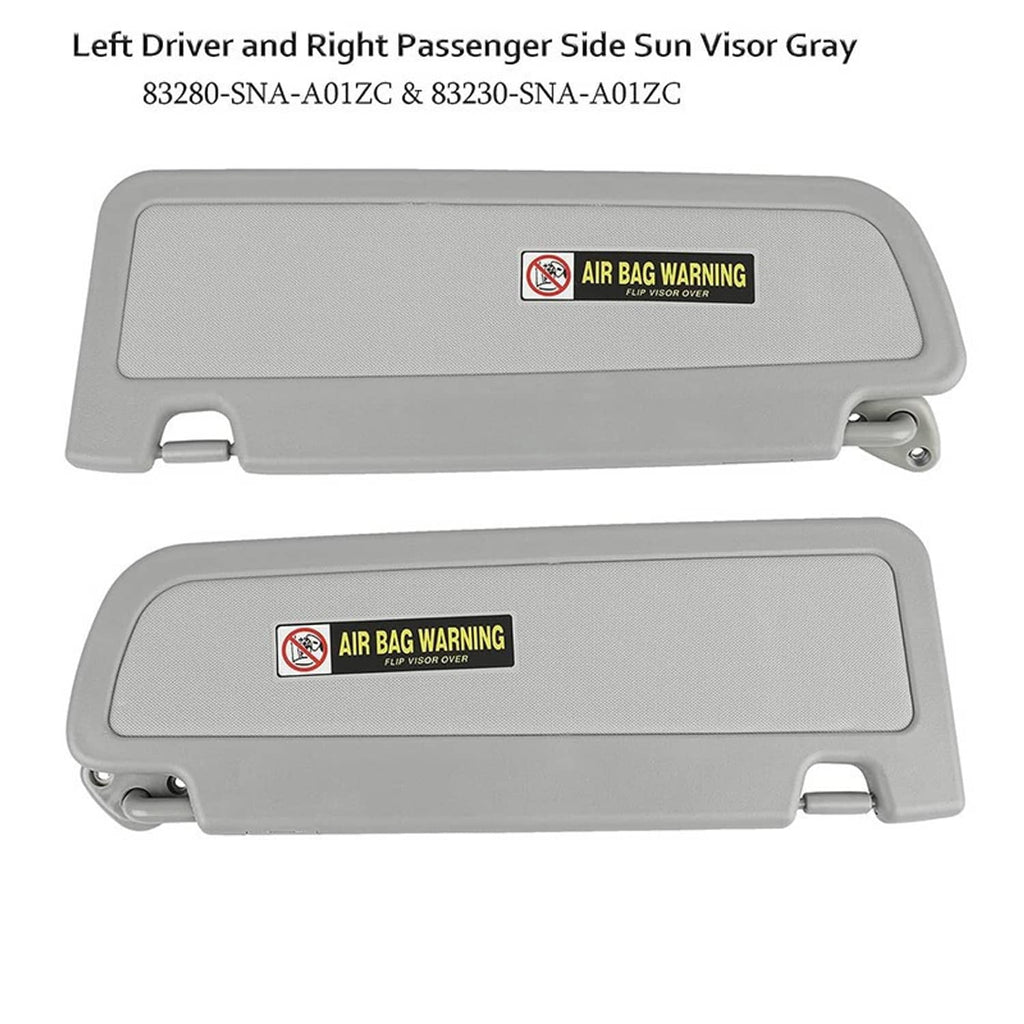 Gray driver and passenger side sun visors with air bag warning labels
