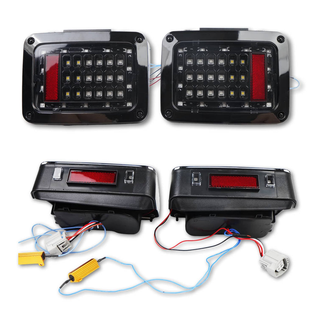 LED tail/turn light housings with red lens windows and attached wiring harnesses
