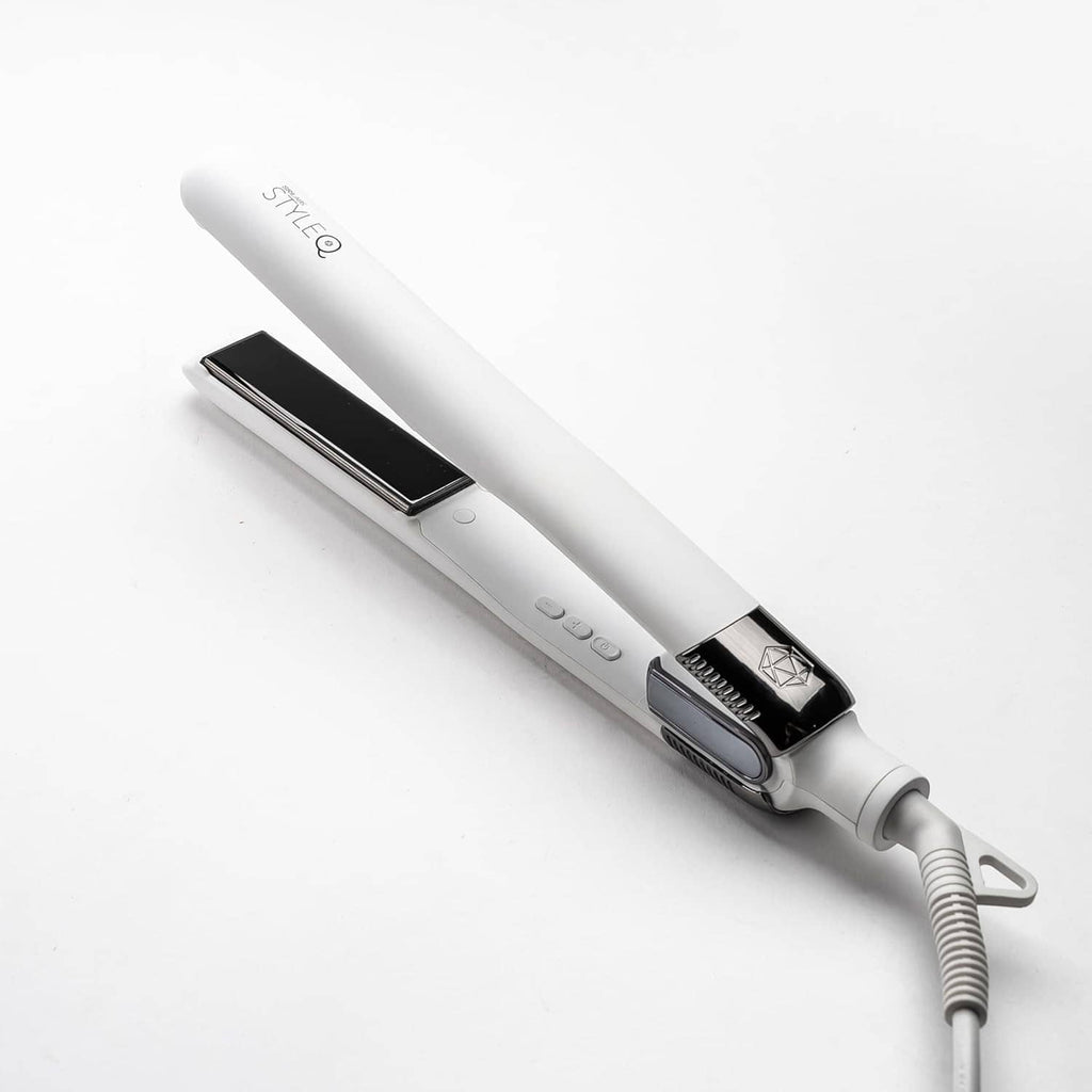 White flat iron hair straightener with black ceramic plates and power cord
