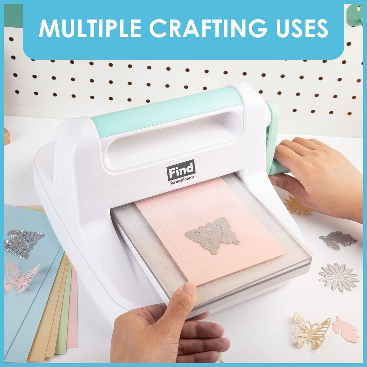 Desktop die cutting and embossing machine with teal lever pressing a patterned card