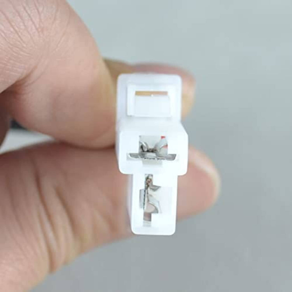 White alternator plug connector pigtail with visible internal terminals