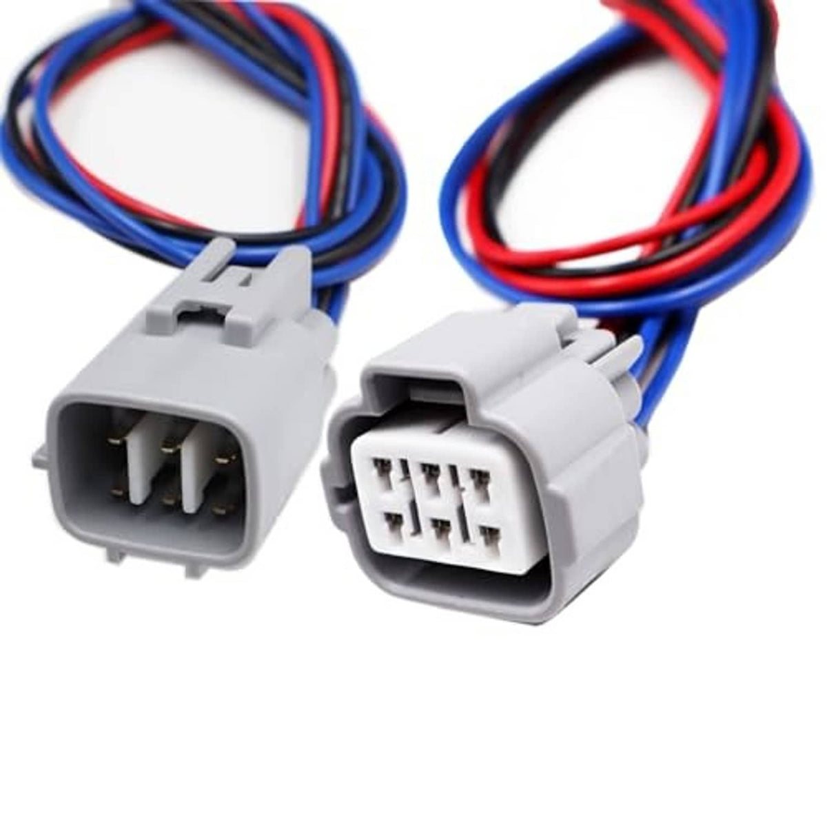 Close-up of 6-pin headlight connector plugs with gray housings and terminals