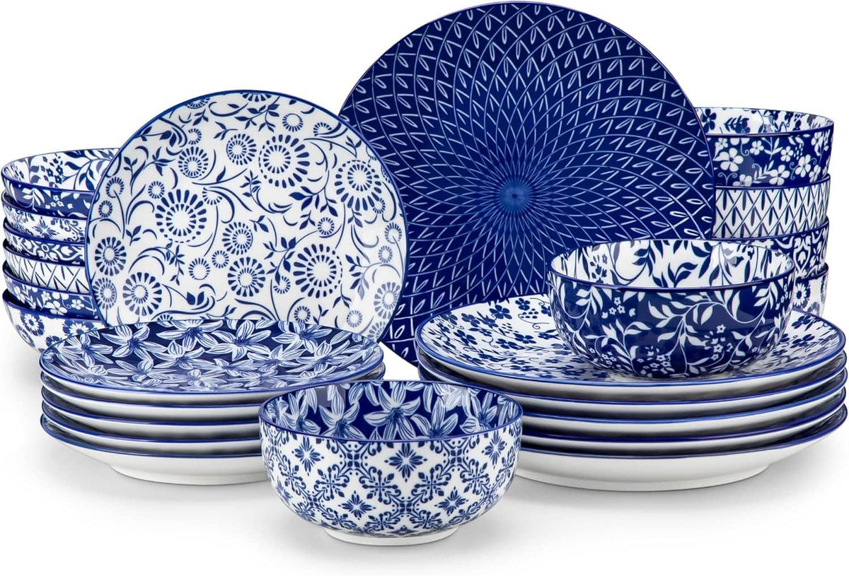 Blue and white porcelain dinnerware set: plates and bowls with patterned design.