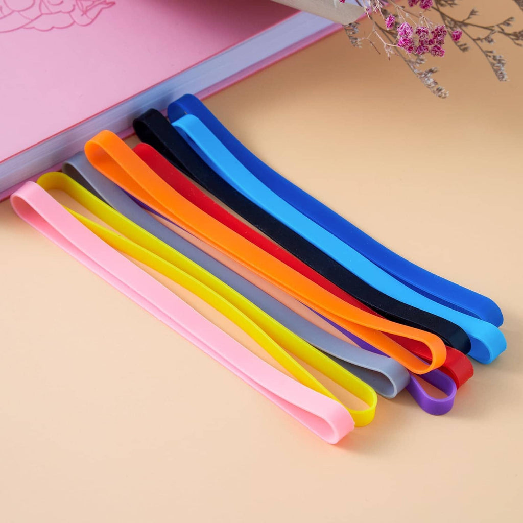 Colorful silicone elastic bands stacked in pastel shades, flat curved loop shape