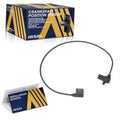 Crankshaft position sensor with black wiring harness and electrical connector, plus manual
