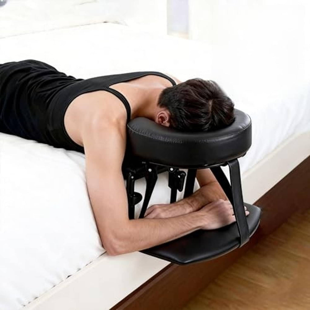 Black padded massage headrest with armrest and metal legs, adjustable for bed use