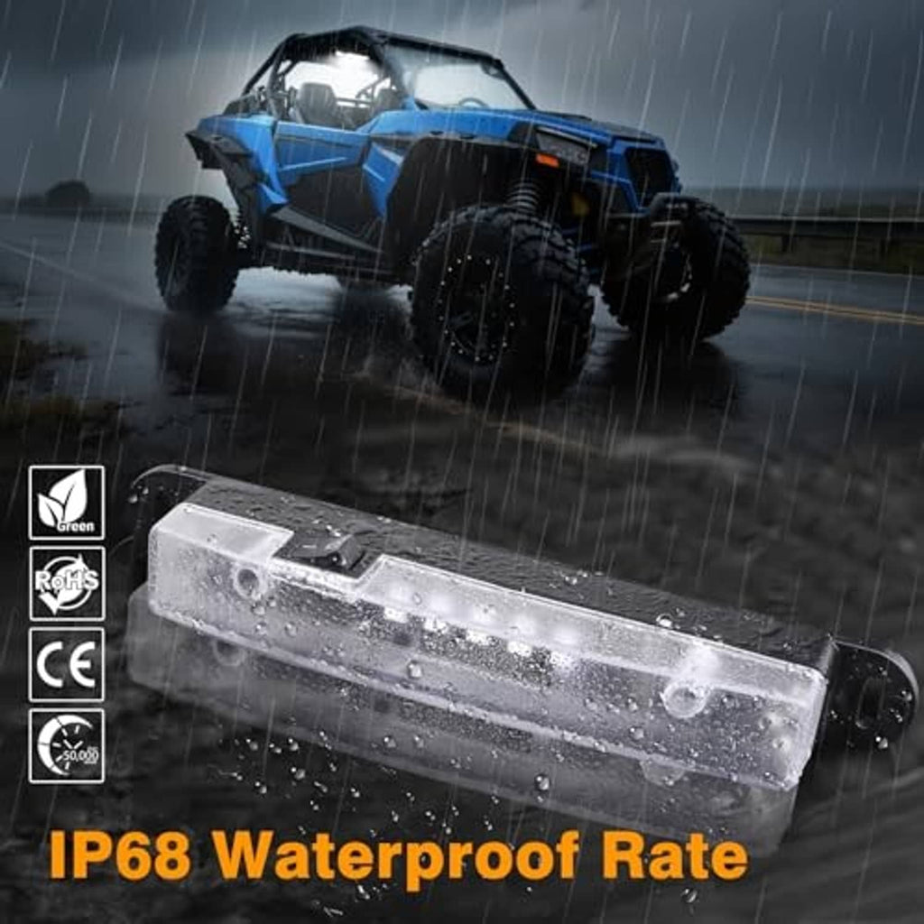 Waterproof-rated clear-lens LED light bar on roll cage, rain droplets visible