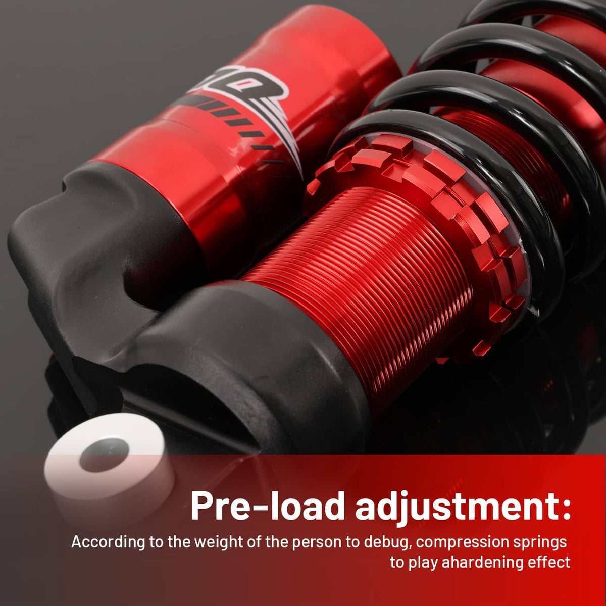Close-up of red shock body and black spring assembly with pre-load adjustment area