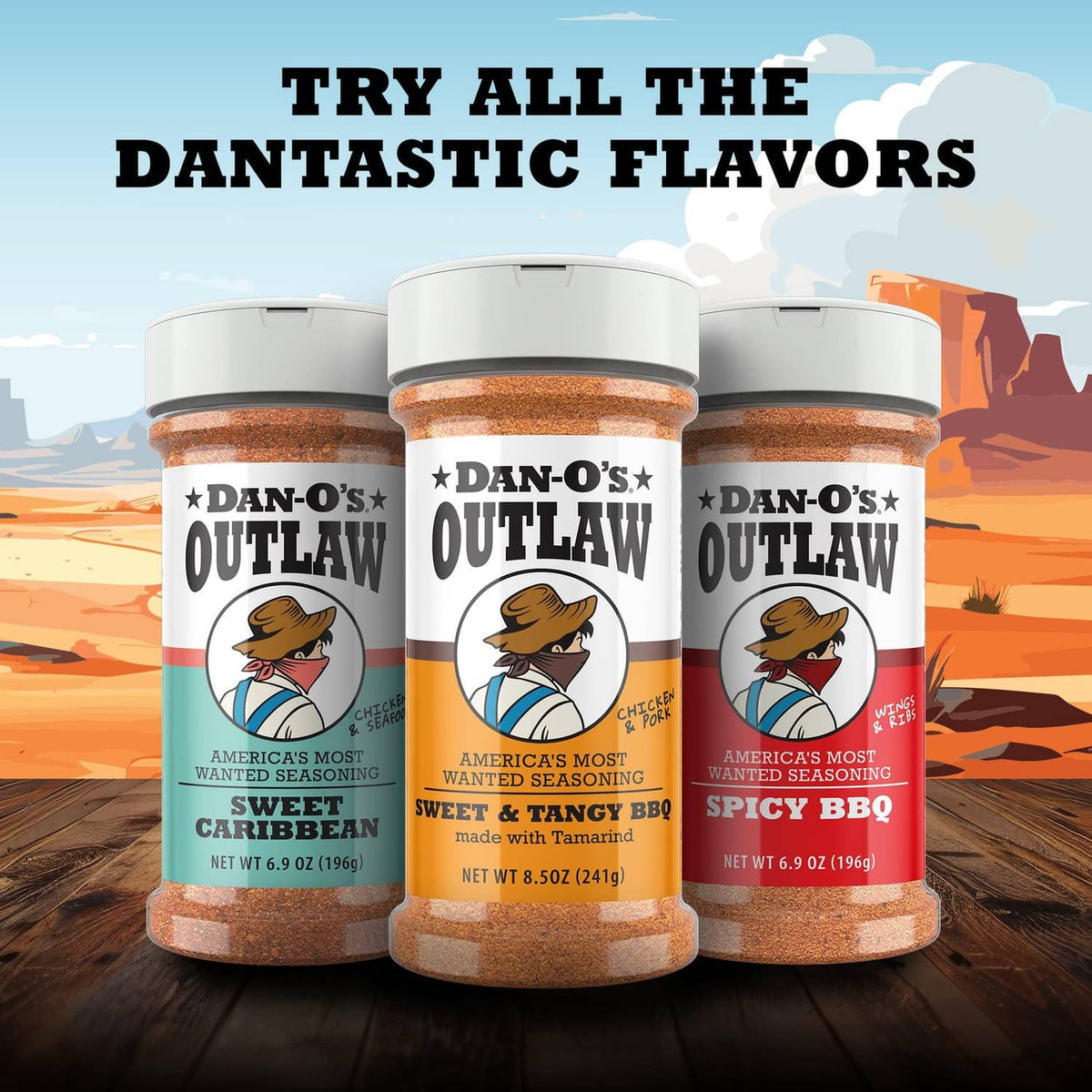 Three Dan-O's Outlaw Sweet Caribbean seasoning bottles lined up on a wooden surface