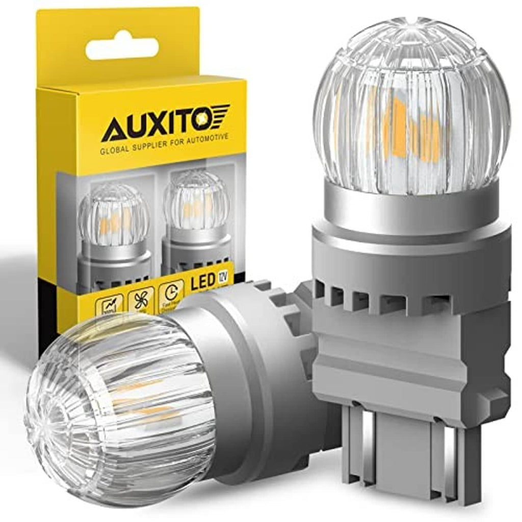 Amber LED turn signal bulbs with clear dome lens, two-piece set on white