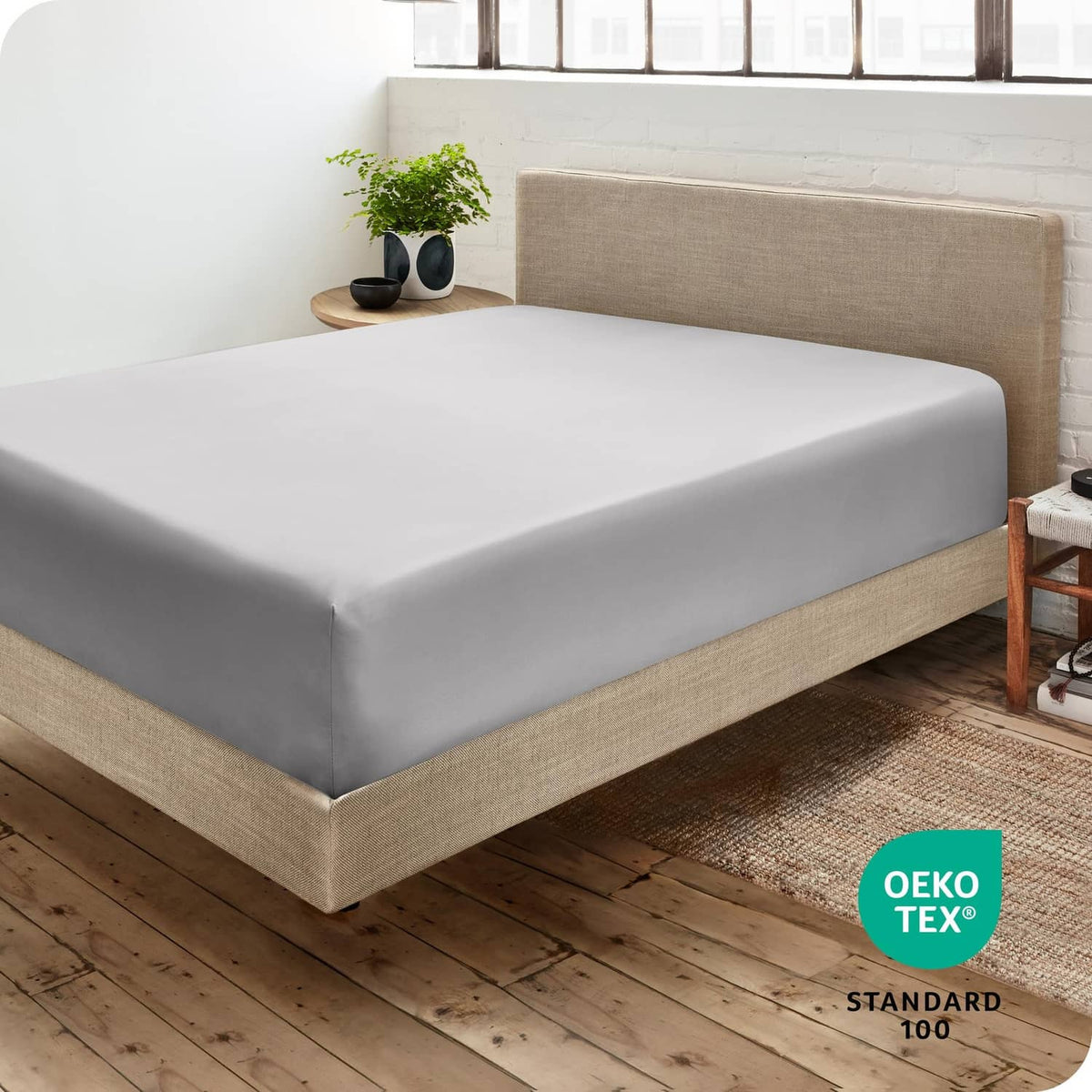 Light grey California king fitted sheet on bed mattress, smooth top and sides