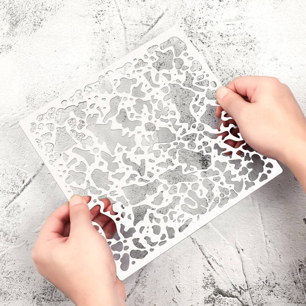 Knockdown texture drywall repair sheet held by hands, white speckled pattern