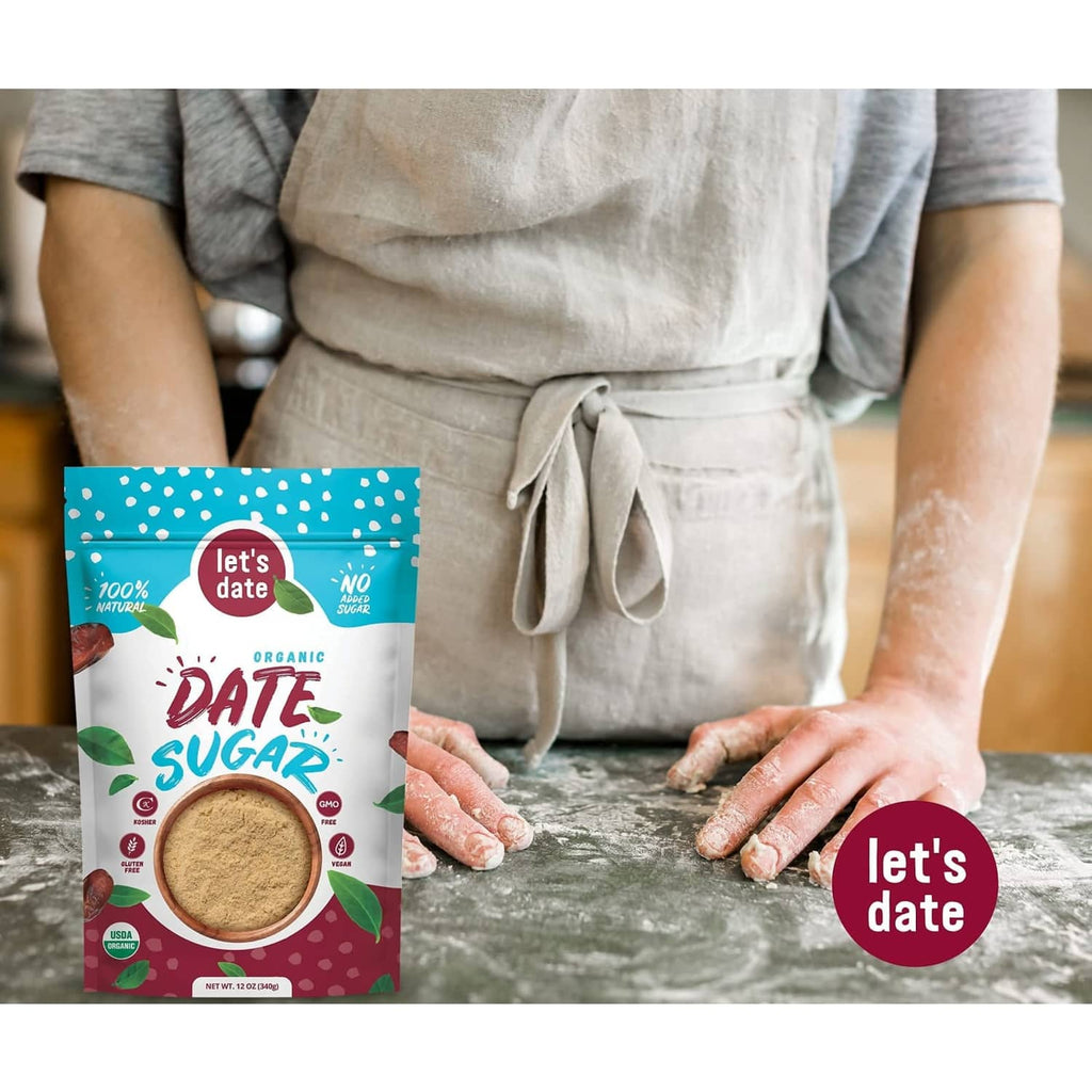 Organic date sugar pouch held beside spoonful powder on countertop