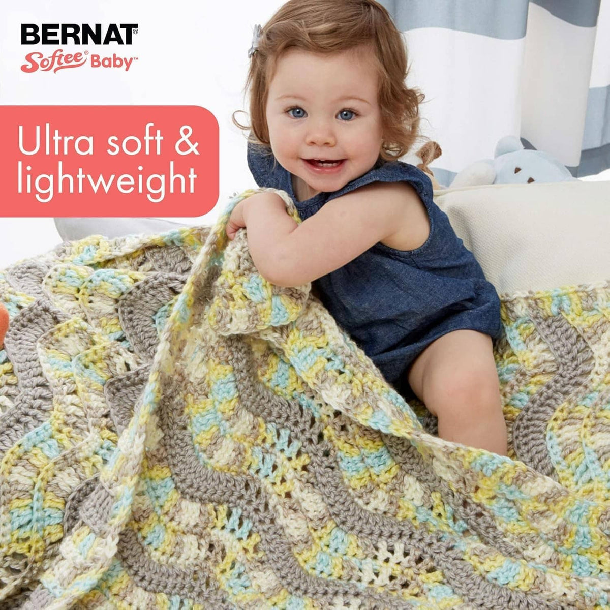 Crocheted baby blanket in lavender, yellow, gray, and blue with textured knit pattern