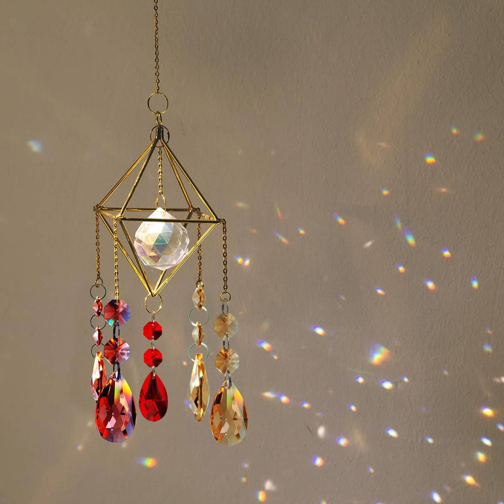 Decorative hanging crystal ornament with faceted drops and metal chain loops.