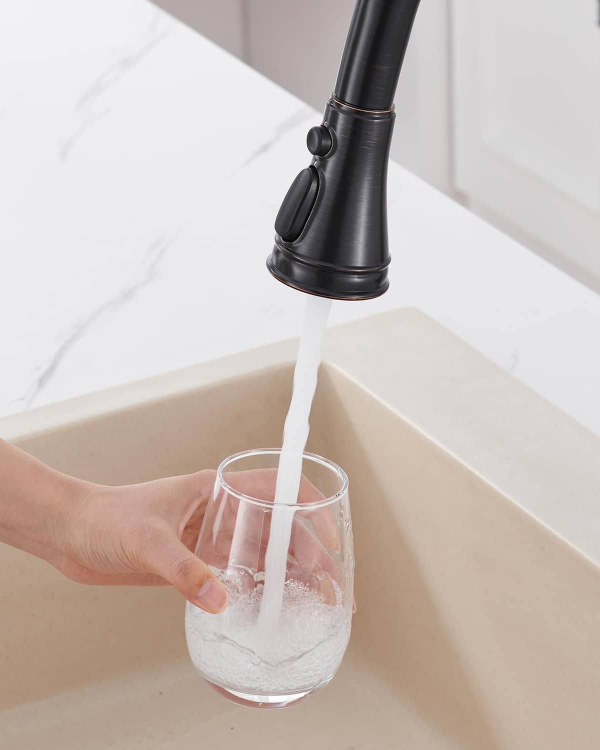 Kitchen faucet sprayer head replacement delivering a steady water stream into a glass