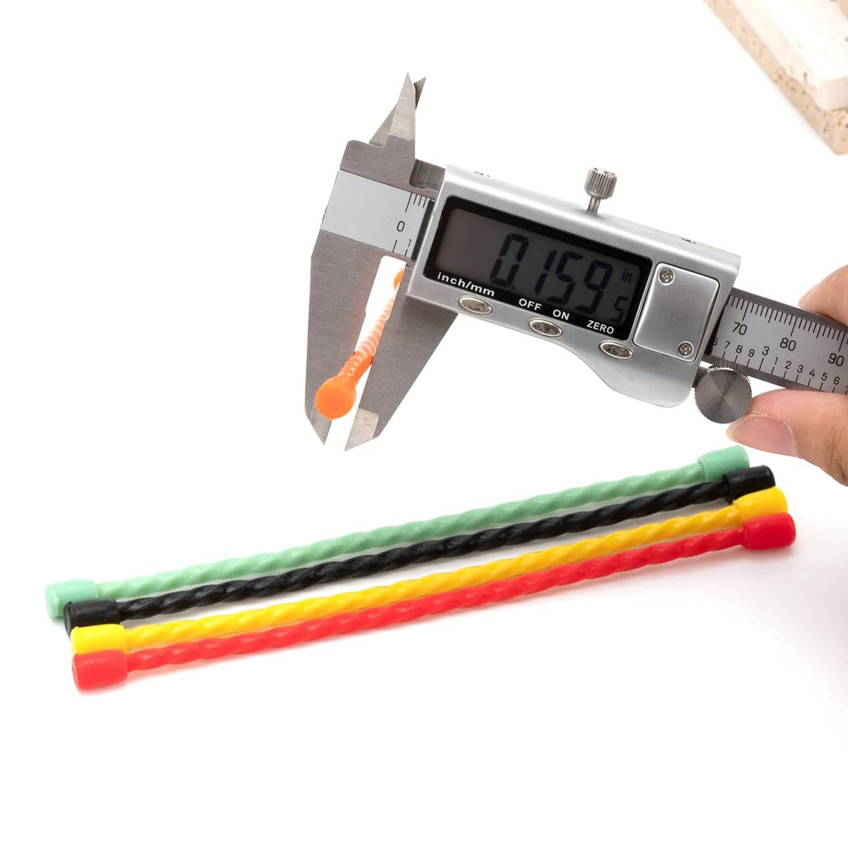 Reusable silicone cable ties in green and black, with caliper measuring thickness