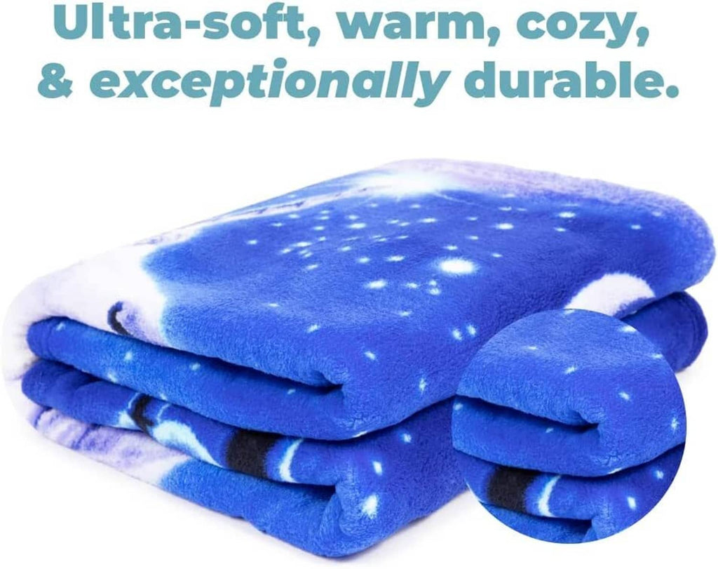 Folded unicorn fleece blanket in bright blue with starry night pattern