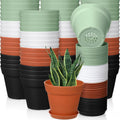 4-inch plastic plant pots set, stacked in mint, black, orange, and white; with drainage.