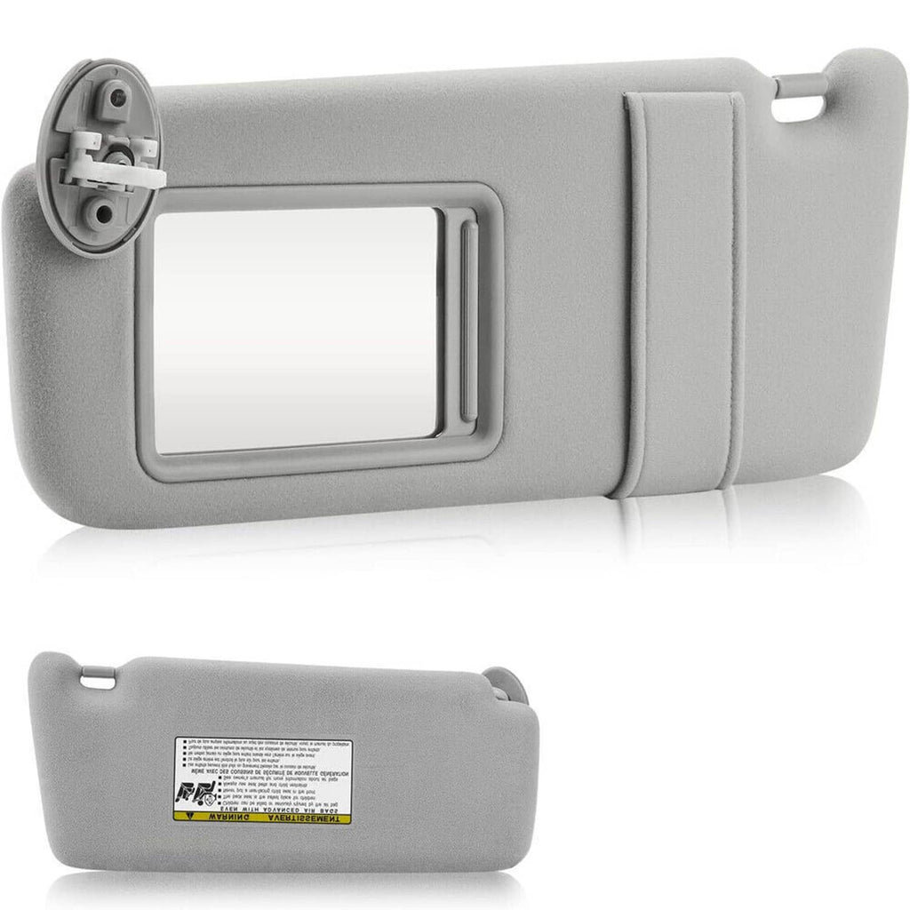 Light gray left driver-side sun visor with mirror cutout and underside label