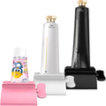 Toothpaste tube squeezer set with pink, white, and black holders and gold caps