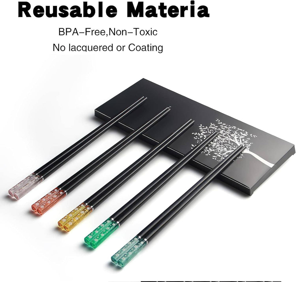 Reusable chopsticks with black stems and clear floral sleeves on storage tray