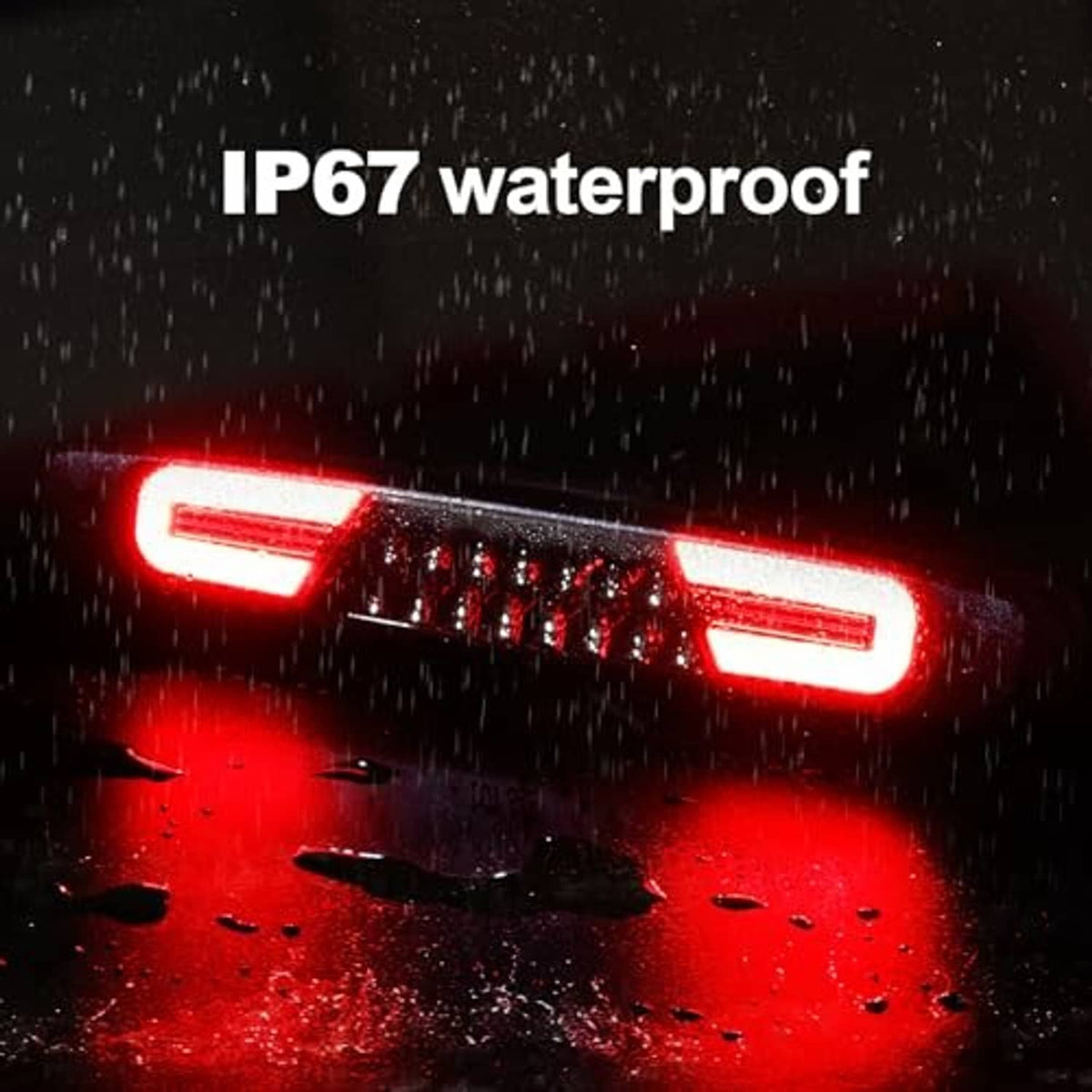Smoked-lens LED third brake light glowing red in rain, IP67 waterproof text