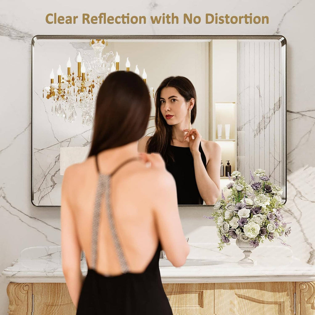Rounded rectangle bathroom mirror with brushed nickel metal frame and clear reflection glass