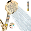 Gold handheld filtered shower head with round spray face and steady water stream