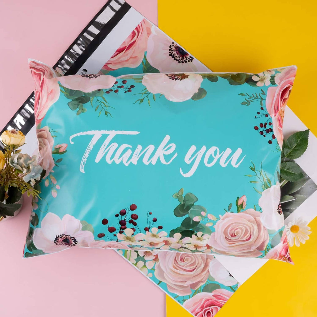 Turquoise floral poly mailer bag with 'Thank you' text and pink rose edging