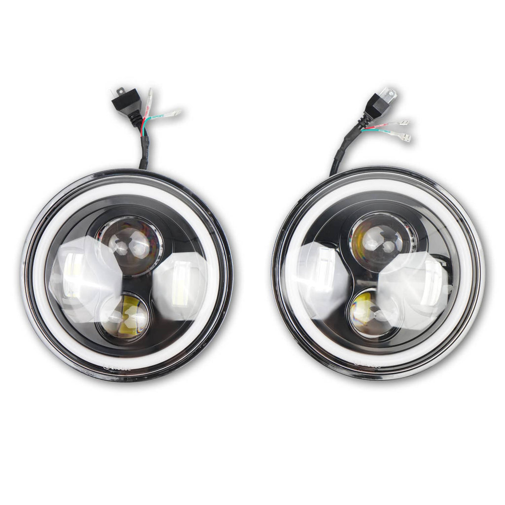 Pair of round LED headlights with chrome trim, clear lens, and compact internal reflector