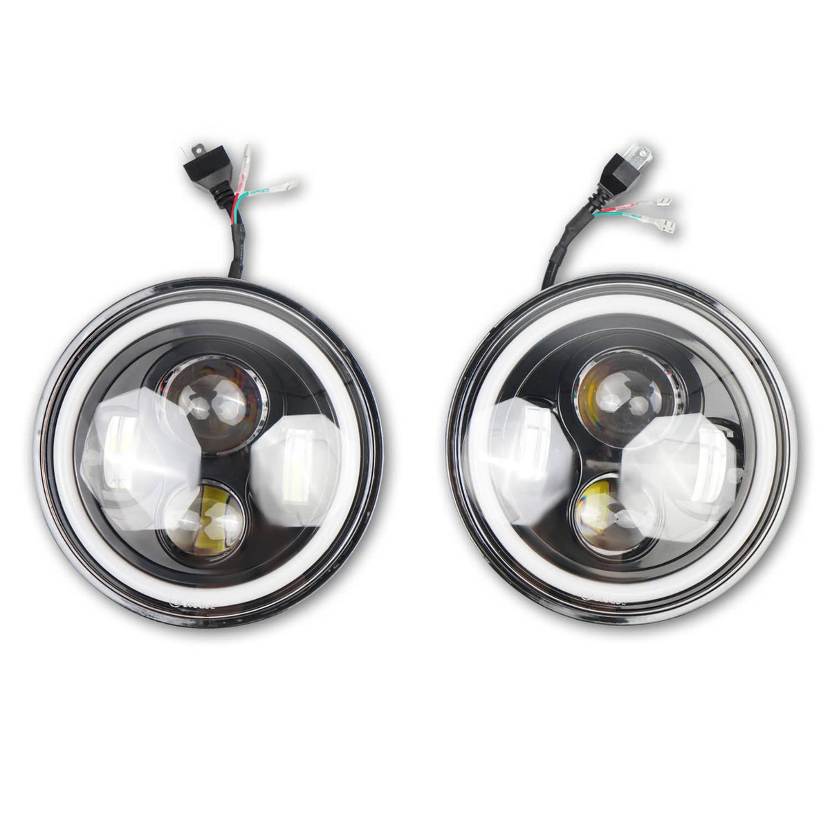 Pair of round LED headlights with chrome trim, clear lens, and compact internal reflector
