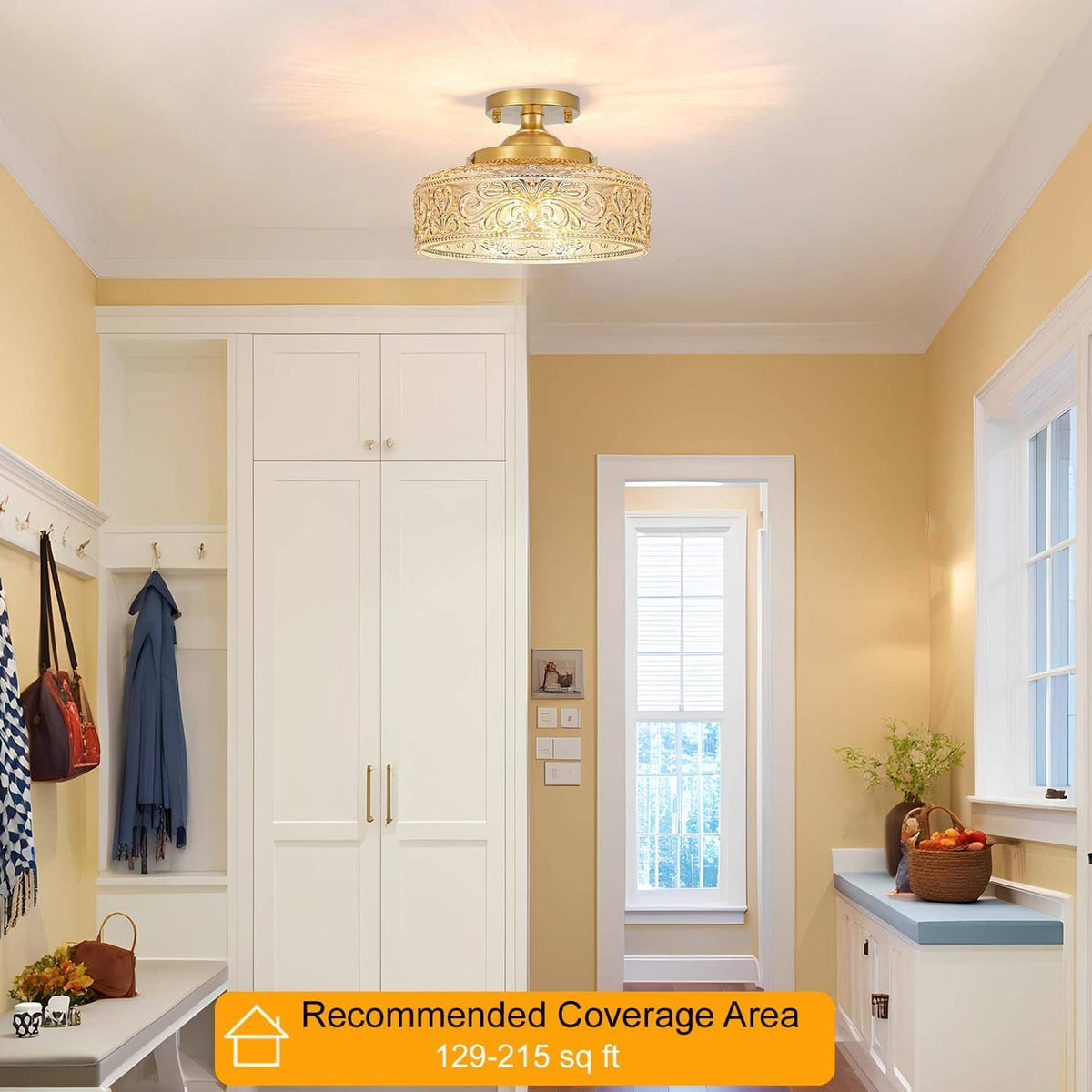 Gold semi-flush ceiling light with ornate glass shade mounted on ceiling