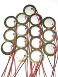 Set of 15 piezo drum trigger discs with red and black wire leads