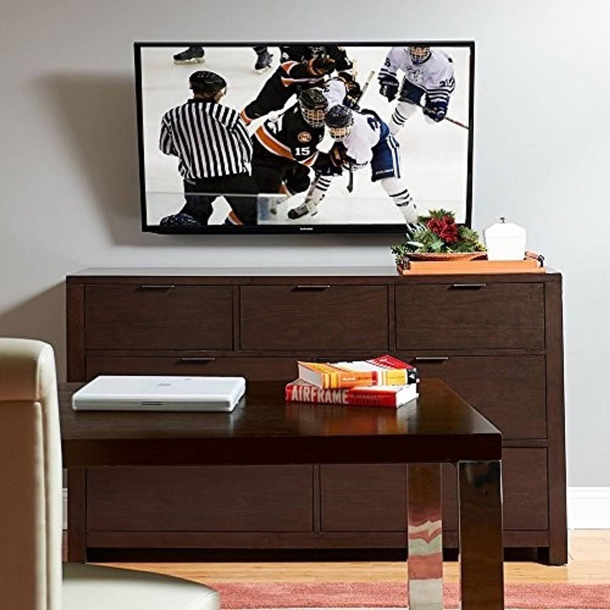 Full-motion TV wall mount with VESA plate extending from wall for flat-screen