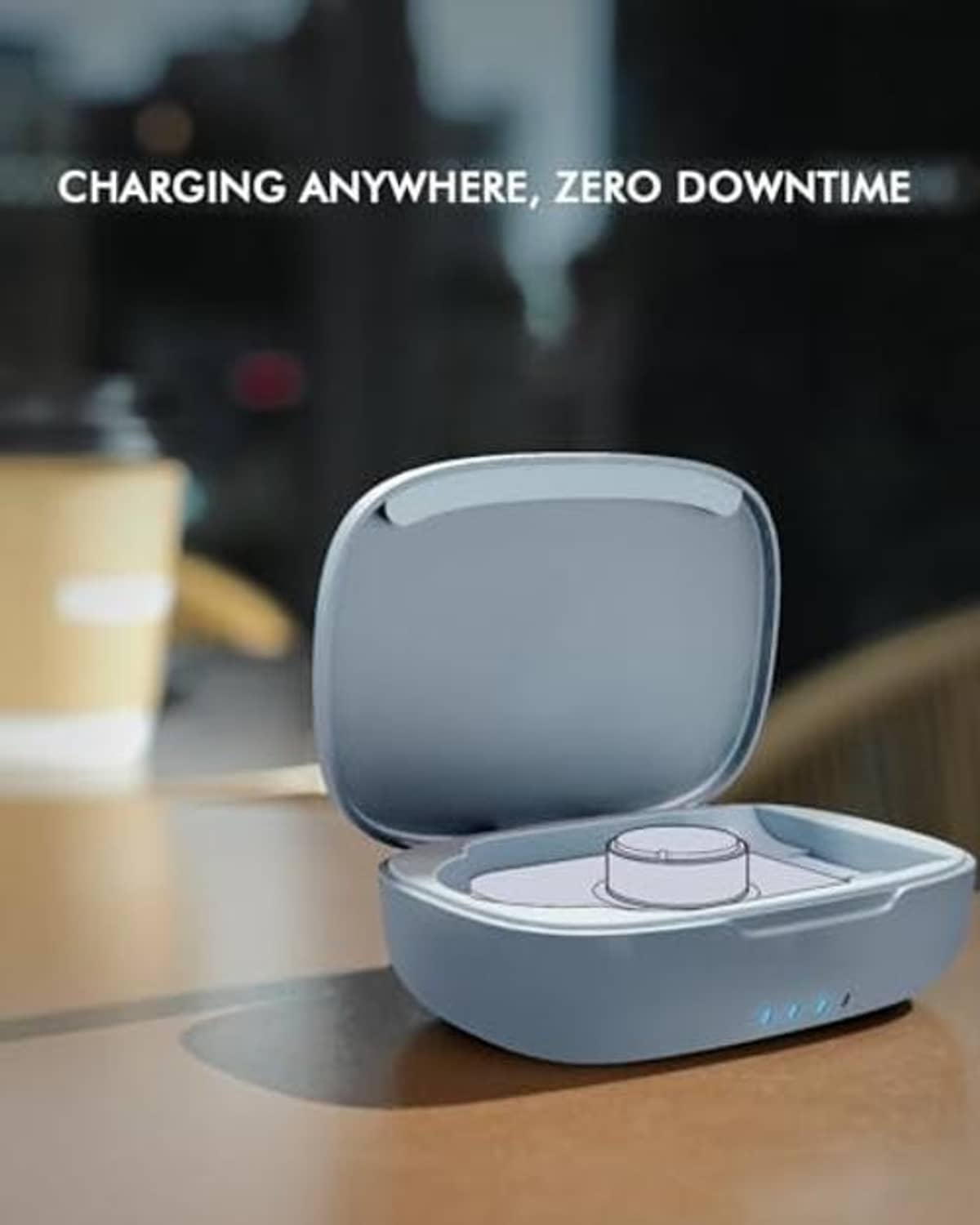 Blue charging case on desk with lid open and charging puck visible
